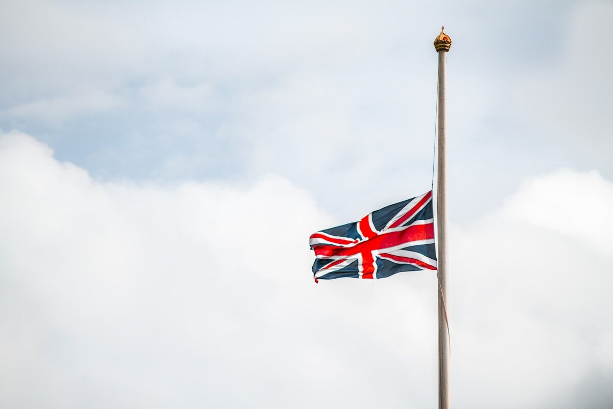 union jack flag under white clouds